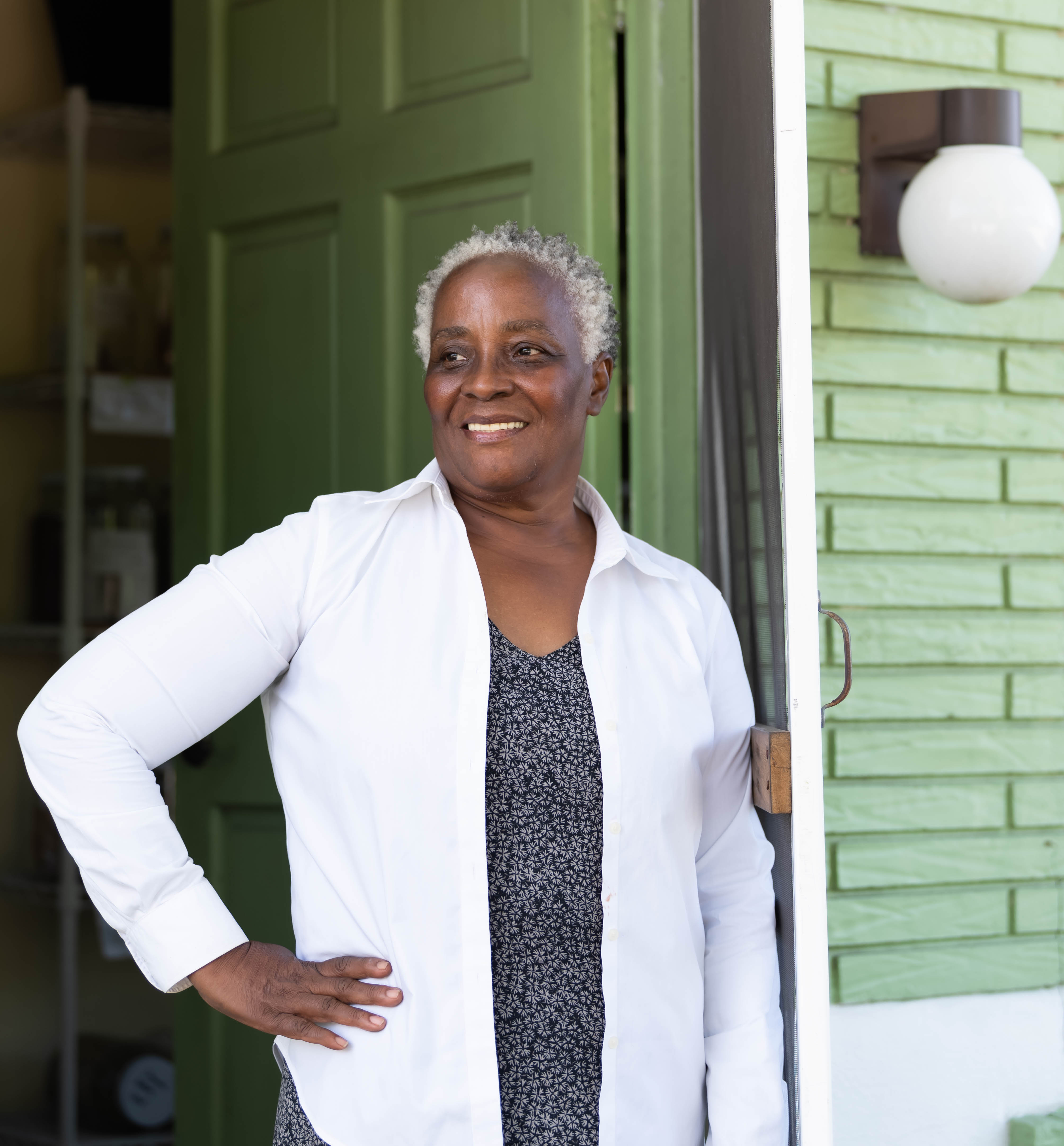 Pauline standing in the doorway at Green Foods Market